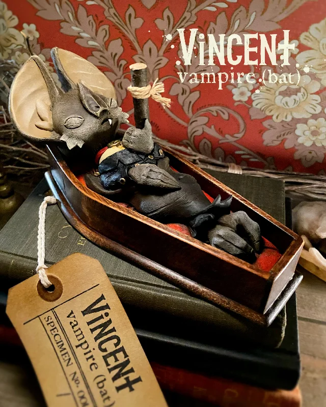 - ​​Christmas pet Christmas clothingWhispers Through The Keyhole - Vincent the Vampire Bat by Saint Monday